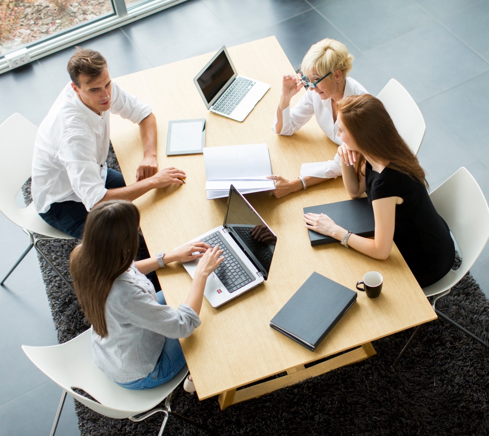 Successful group of business people working on plans